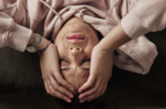 woman with her hands on her end struggling with brain fog from depression